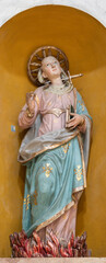 PAVIA, ITALY - SEPTEMBER 8, 2024: The carved baroque polychrome statue of St. Lucia in the...