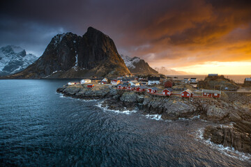 Coastal Village with Red Cabins at Sunset