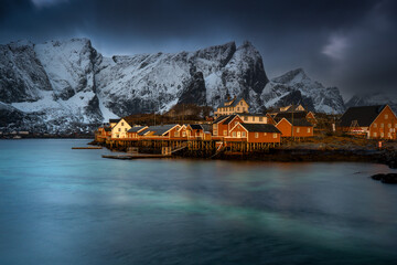 Coastal Village with Snowcapped Mountains