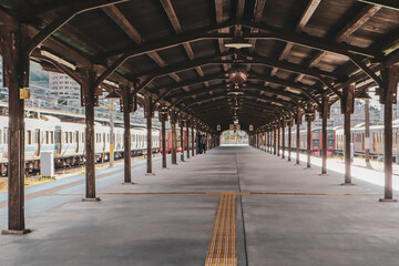 Historic Mojiko Station Platform with Traditional Wooden Architecture and Train in Fukuoka, Japan