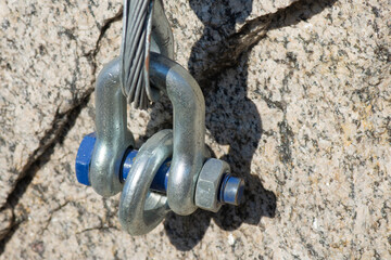 Connection and fastening of iron cables with a steel turnbuckles. Fastening elements of the cable...