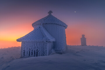Snow-Covered Chapel at Sunset
