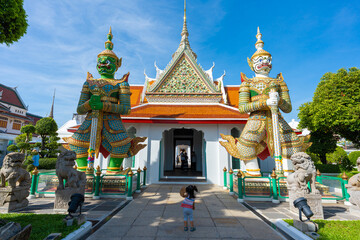 Naklejka premium Gates to Ordination Hall with statues of Giants, demon guardians at Wat Arun