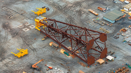 Aerial top view large oil rig is being repaired.
