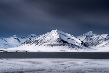 Snow-Covered Mountains and Lake in Winter