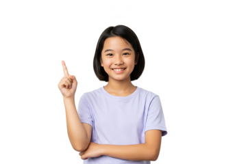 A smiling asian girl in a purple shirt is pointing up, isolated on white background