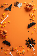 Festive vertical Halloween-themed items featuring pumpkins, candy, bats, bones, and spiders on...