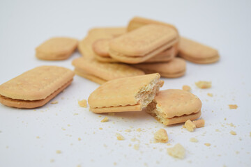 Cream-filled sandwich cookies on a white surface.