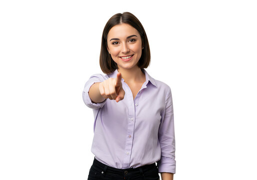 A smiling young woman in a lilac shirt is pointing her finger directly at the viewer isolated on transparent background