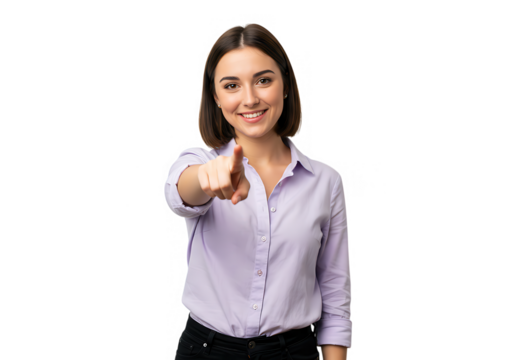 A smiling young woman in a lilac shirt is pointing her finger directly at the viewer isolated on transparent background