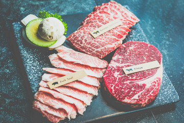 various kinds of meat waiting to be grilled in a korean grill restaurant