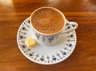 A cup of tasty Turkish coffee with a foam