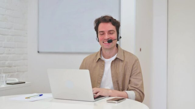 Smiling Call Center Agent Looking at Camera