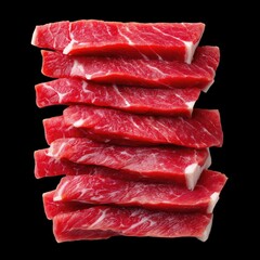 Fresh beef slices stacked neatly on black background, showcasing vibrant red color and marbling, perfect for culinary presentations or recipes