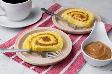 Roll cake or swiss cake filled with dulce de leche