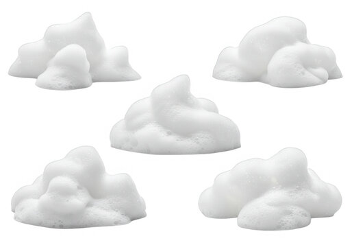 A collection of five piles of white shaving foam or cream isolated on transparent background