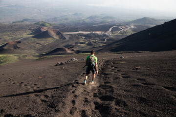 hiker trekking on mount Etna