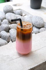 Pink milk and espresso unite in this dreamy iced latte fusion. Bold contrast, gentle sweetness.