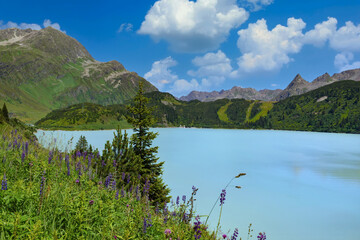 Reservoir lake with mountains epic landscape. Idyllic reservoir Kops lake at 1800 m in austrian Galtur, Vorarlberg