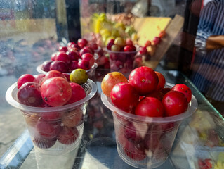 Plums in Plastic Cups Fresh Red Fruits Still Life