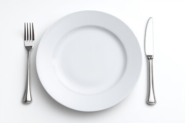 Selective focus white dish with spoon, fork and knife isolated on white background, Luxury fine dining dish with silverware on white background.