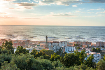 Small village with morning in state of Jijel, Algeria, rural village, A beautiful Mediterranean village in North Africa, Algeria from above, A small town overlooking the Mediterranean sea.