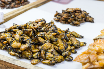Vendor selling dried oyster in seafood market