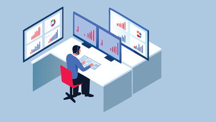 Person working at desk with multiple monitors displaying charts and graphs in an office setting