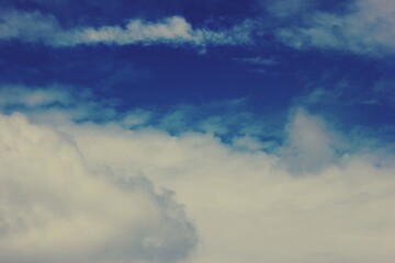 Deep Blue Sky with Soft White Clouds