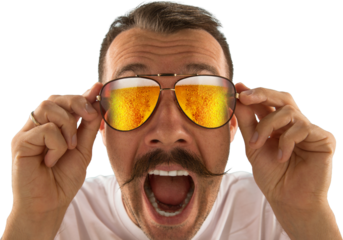 Bearded older man in tropical shirt, looking surprised through sunglasses filled with beer. Concept of lifestyle branding for beverage-related campaigns