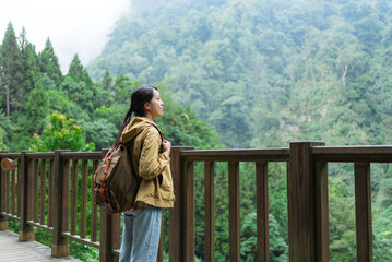 Outdoor woman hiking and looking at scenic view