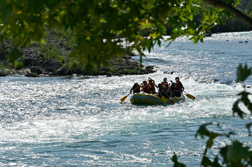 rafting. groups rafting down a flooded river