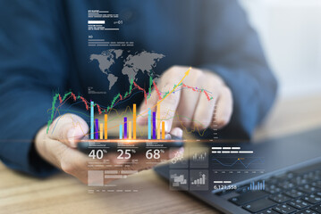 Businessman analyzes financial plan with stock market trends, using bar chart and graph to track...