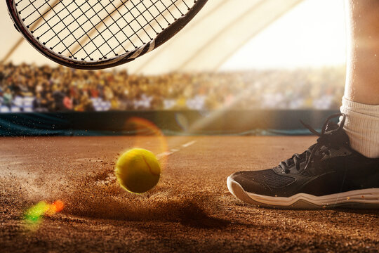 Yellow tennis ball strikes the red clay court with dust rising, close to a foot and racket in 3D environment. Concept of precision and focus for executive decision-making and leadership training