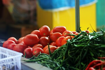 Fresh Tomatoes and Green Chilies at the Market