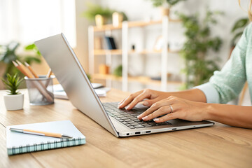 Modern Writing Table with Laptop, Pen, and Window Light
