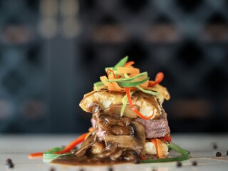 beautiful dish of roasted pork shoulder topped with a fennel slaw and a honey drizzle