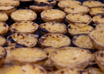 Delicious nativity scenes on a tray. Pastries filled with custard.