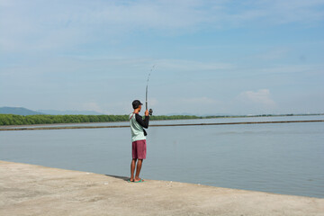 Fisherman on the seashore