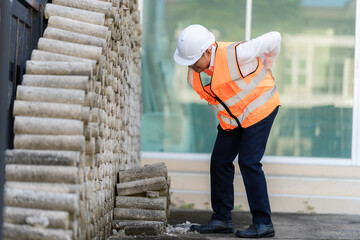Man, construction worker and back pain from injury workplace accidents or muscle spasms from...