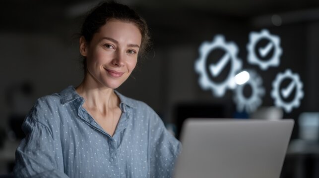 Young woman smiling working on laptop with gear check icons overlay