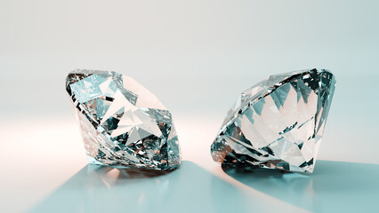 Two sparkling diamonds reflecting light on white background