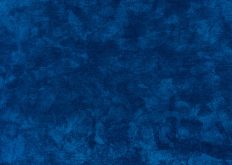 dark blue crushed velvet texture close-up, soft luxurious fabric background for design. dark blue fluffy carpet for interior floor covering.