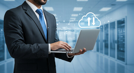 Modern office worker engaging with a laptop, illustrating efficient remote data access and cloud services.