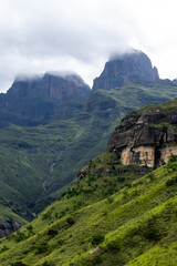 Dramatic view sentinel peaks rising into the gathering clouds in the Drakensberg Mountains of South Africa.