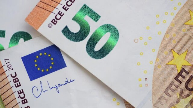 Macro close up of details on the European Union 50 Euro bank notes.
