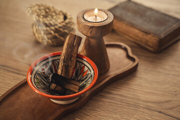 Burning Palo Santo and Candle on Wooden Tray for Relaxation and Meditation