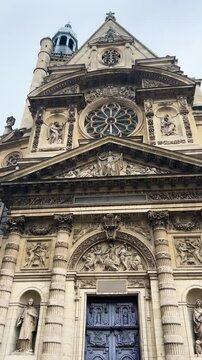 West front of the facade of the church of Saint-Etienne-du-Mont, 5th arrondissement of Paris on the rue Clovis near the Lycee Henri IV and the Pantheon. Vertical video.