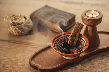 Burning Palo Santo and Candle on Wooden Tray for Relaxation and Meditation