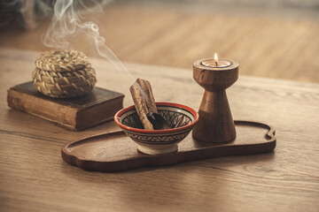 Burning Palo Santo and Candle on Wooden Tray for Relaxation and Meditation